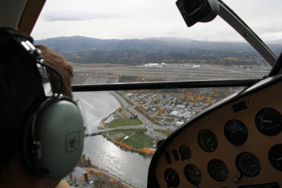 Turning onto the base leg of the approach to Schwatka Lake, with Erik Nielsen Whitehorse International Airport ahead.