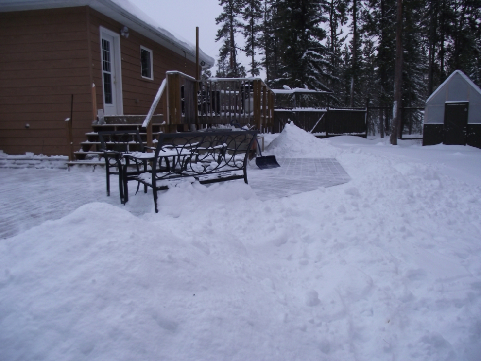 Shovelling snow off the deck in November