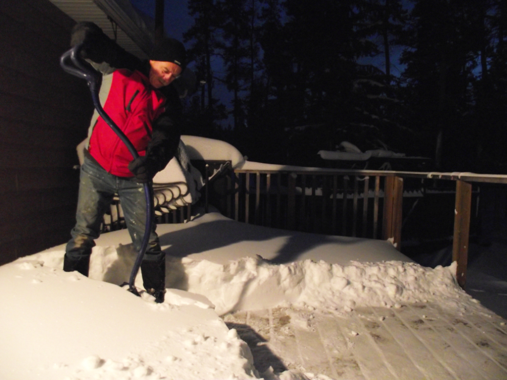 Shovelling snow off the deck in November