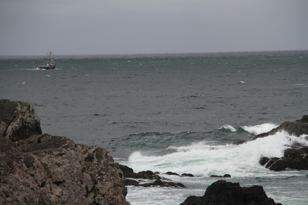 A fishing boat passes Amphitrite Point.