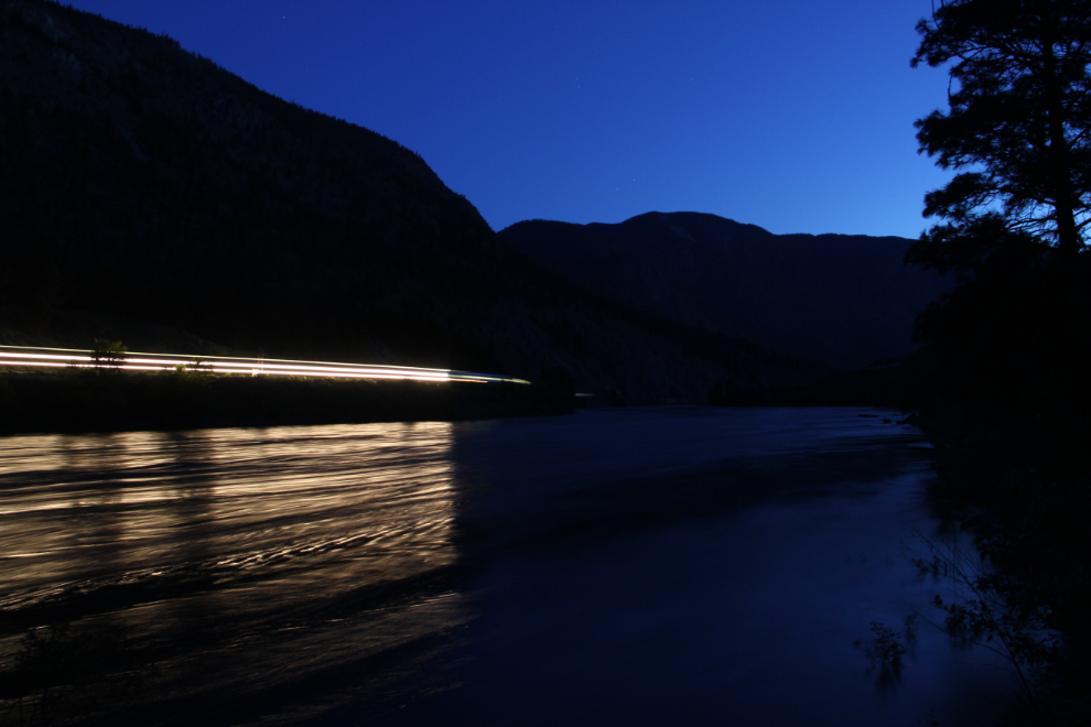 Time exposure of a VIA Rail train along the Thompson River in the early dawn. 