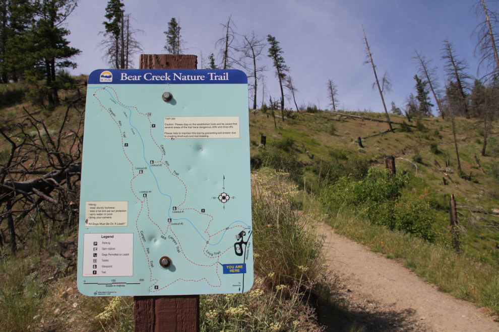 Map sign along a hiking trail in Bear Creek Provincial Park, BC