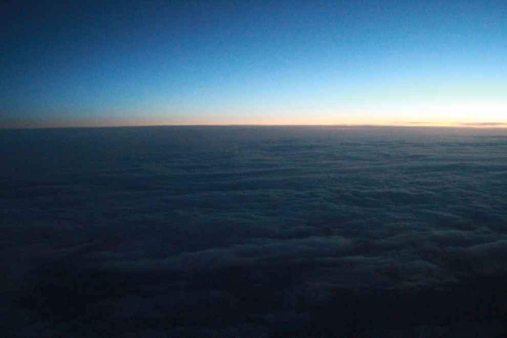 The first light of dawn above the clouds