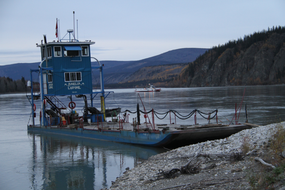 The freight barge Amelia Lupine, with the Dawson ferry crossing the river behind her.