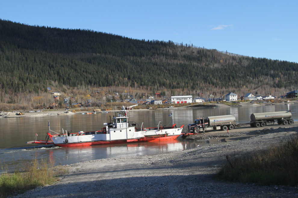 A fuel tanker driving onto the Yukon River ferry at Dawson