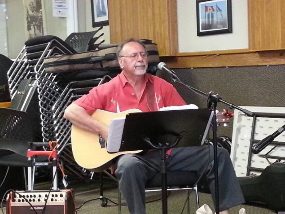 John Cole playing guitar at the Westbank Legion 