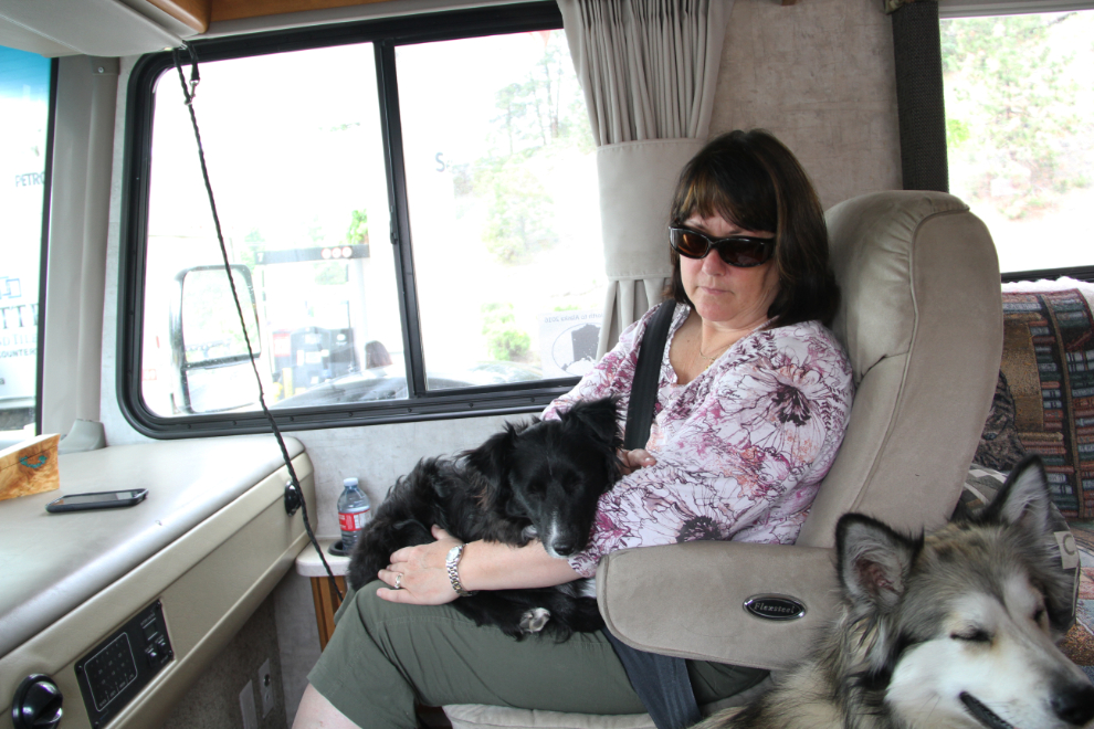 Cathy with our little dog Tucker on her lap in the RV