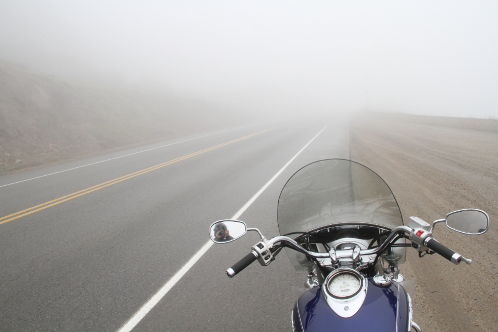Motorcycle on the foggy South Klondike Highway