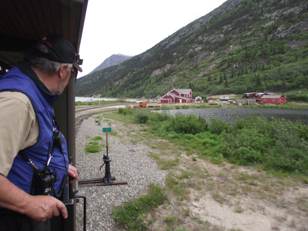 White Pass & Yukon Route train guide Peter Carr watches as we leave Bennett