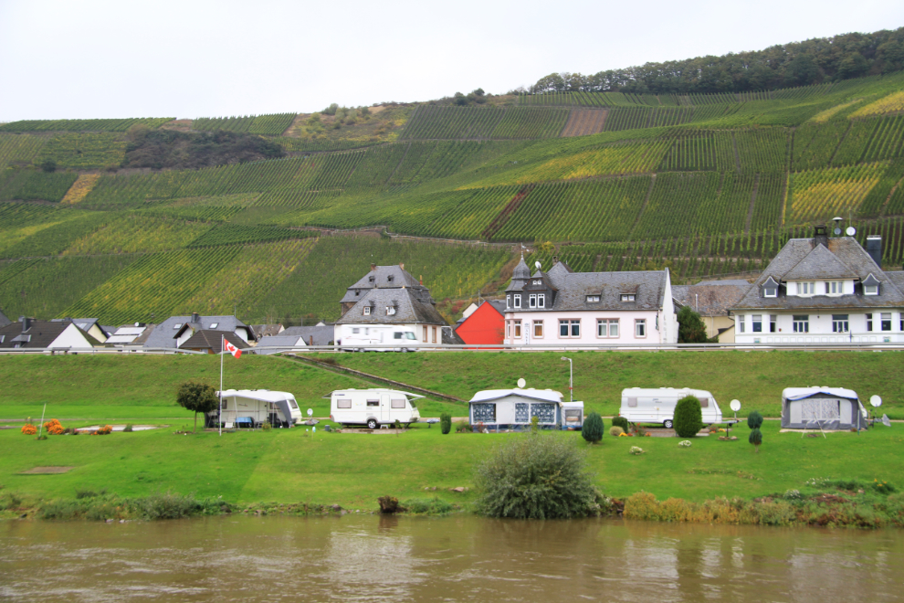 A campground along the Mosel River flying a Canadian flag