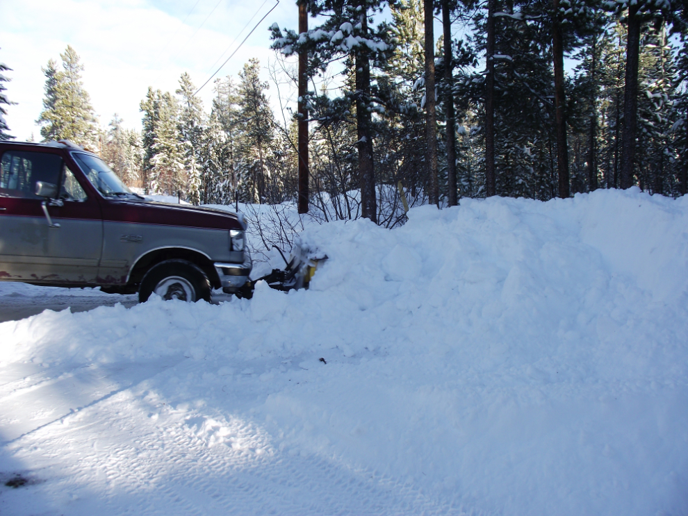 Clearing snow with a truck-mounted plow