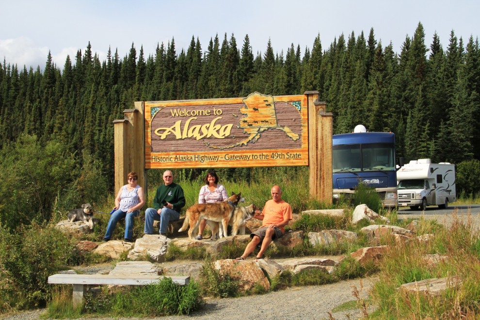 RVs at the Welcome to Alaska sign on the Alaska Highway