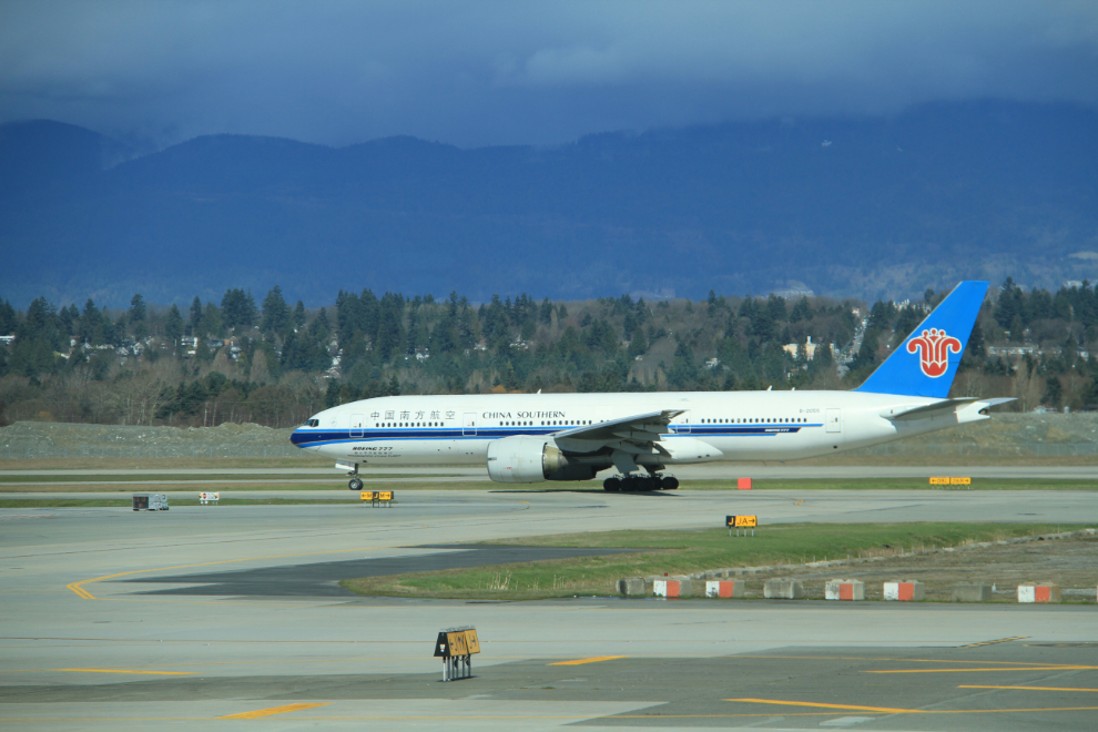B-2055, a Boeing 777-21B (ER) operated by China Southern Airlines, taxis for takeoff on a flight from YVR to Guangzhou, China.
