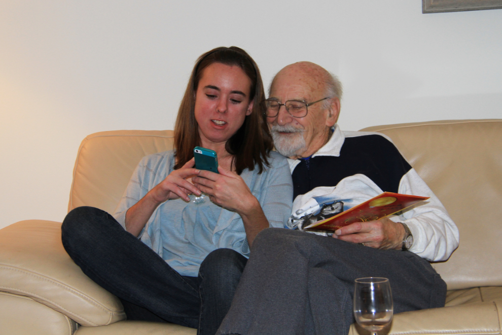 My daughter shows her grandfather some of the cool things a smartphone does.