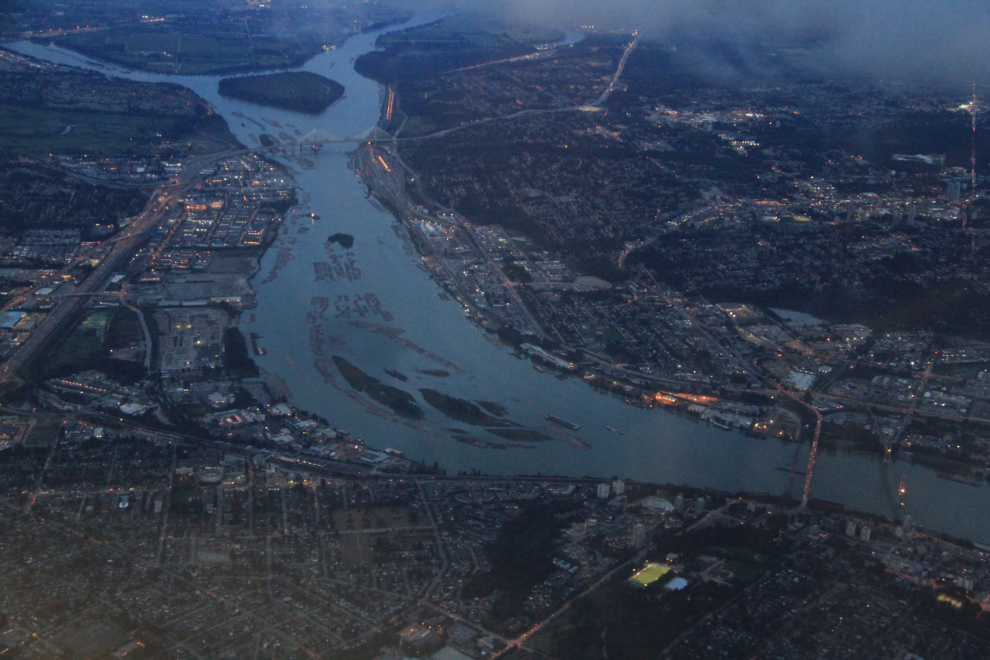 Aerial view of the Fraser River, with New Westminster on the near side and Surrey on the other