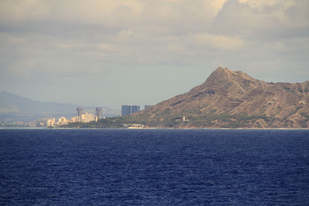 The towers of Waikiki, appearing from behind Diamond Head 
