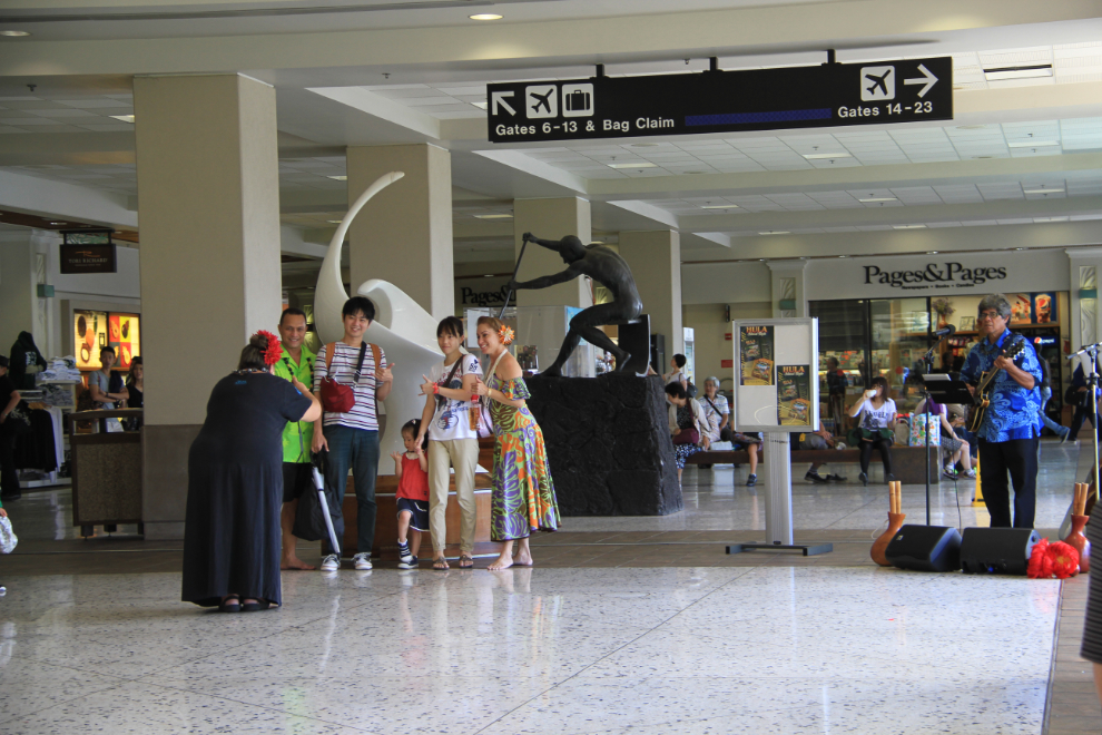 Hawaiian music and a last photo op with a hula dancer in the Honolulu  airport terminal