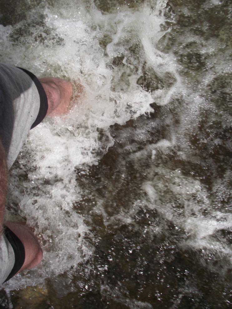 Wading across a Yukon creek