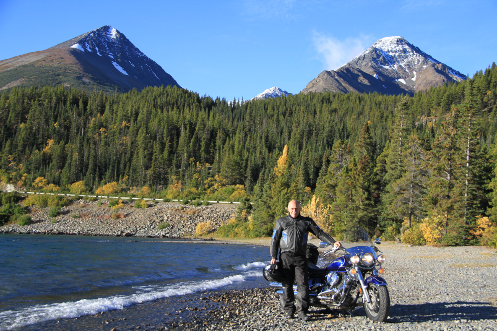 Murray Lundberg on his motorcycle at Tutshi Lake, BC