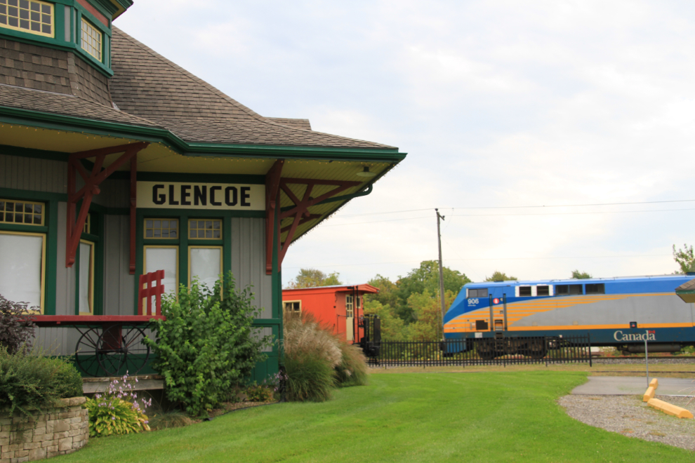 Train speeding by the railway station at Glencoe, Ontario