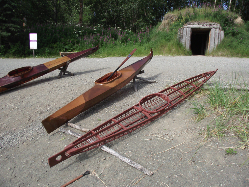 Beautifully crafted kayaks and a dwelling called a ciqlluaq at the Alaska Native Heritage Center - Anchorage, Alaska