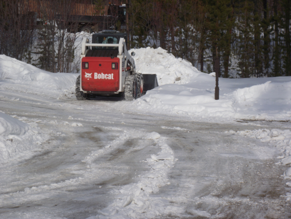 A Bobcat clearing snow and ice off my driveway