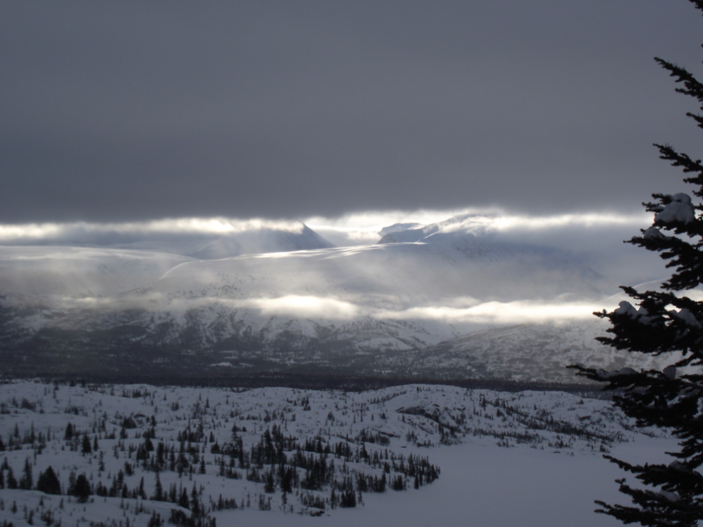 The sun trying to break through over Tormented Valley in the White Pass