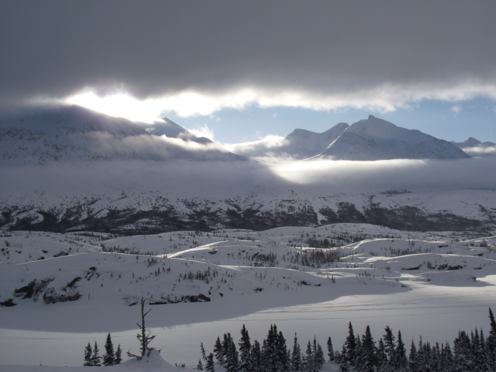 The sun trying to break through over Tormented Valley in the White Pass