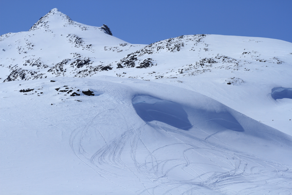 Snowmobile tracks in the White Pass north of Skagway, Alaska