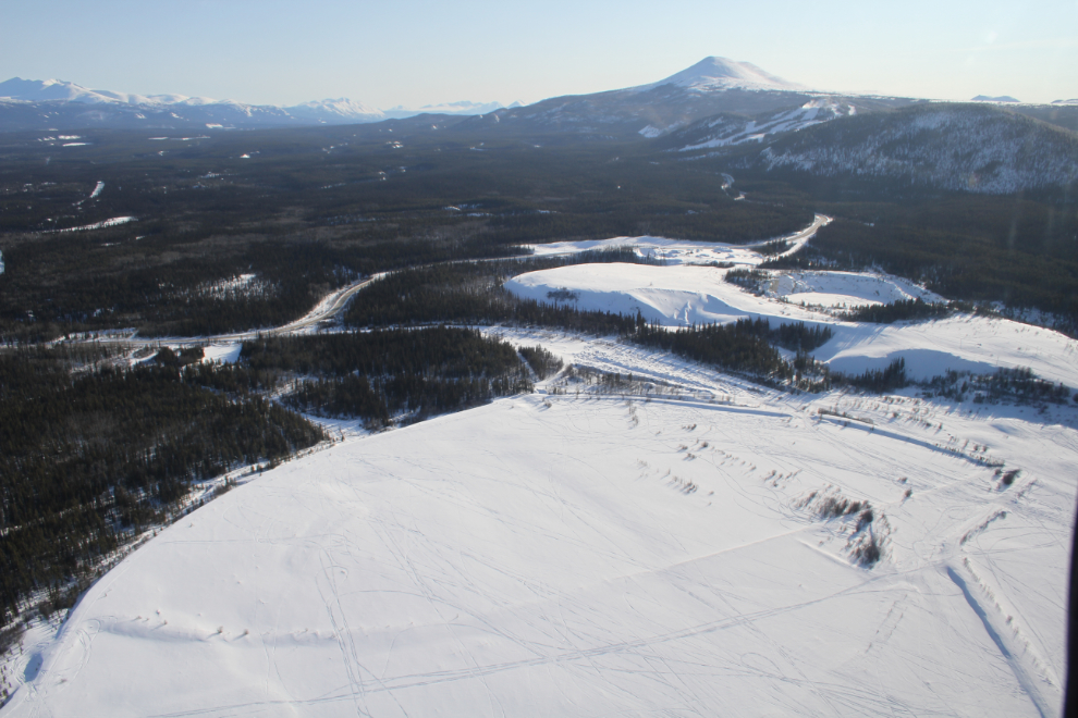 Helicopter view of the tailings pond for the Whitehorse Copper Mine, and the Mount Sima ski hill