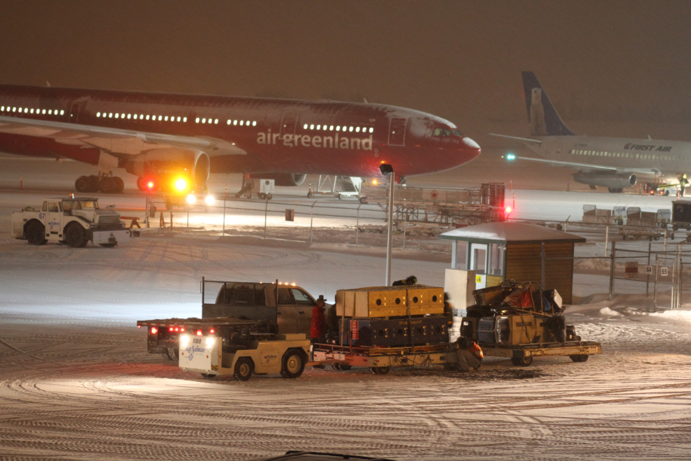 Mushers getting ready to load onto their jet after the 2012 Arctic Winter Games