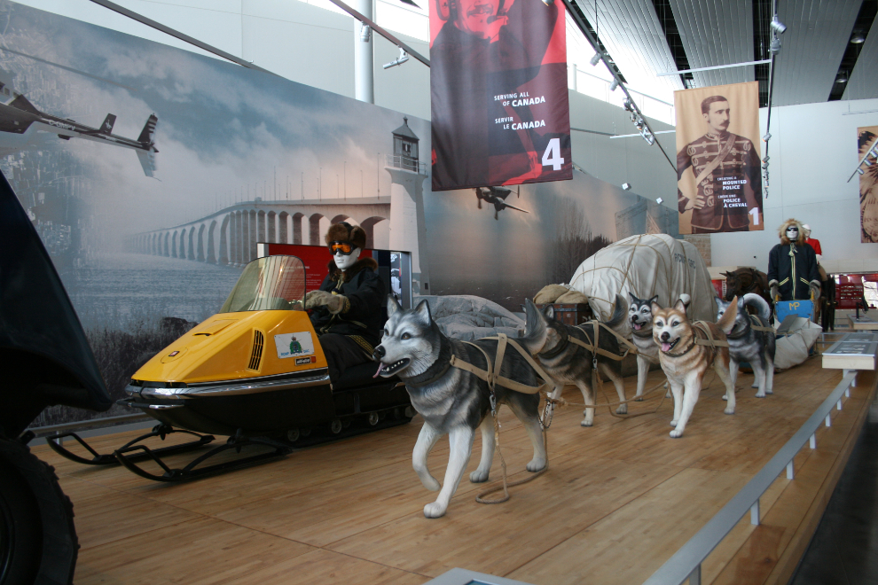 A Yukon Mountie sled dog team and an early Skidoo at the RCMP Heritage Centre in Regina.