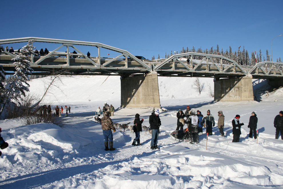 Josh Cadzow passing under the Takhini River Bridge in Yukon Quest 2009