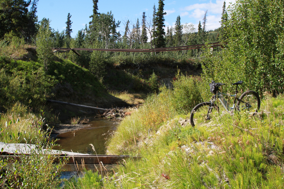 E-bike at a large washout on the long-abandoned WP&YR railway line between Spirit Lake and Carcross, Yukon