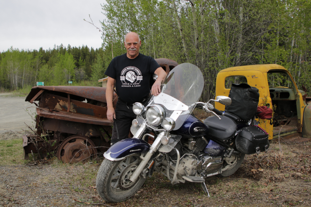 Murray Lundberg with his V-Star motorcycle at the Canol Road rest area on the Alaska Highway, Yukon