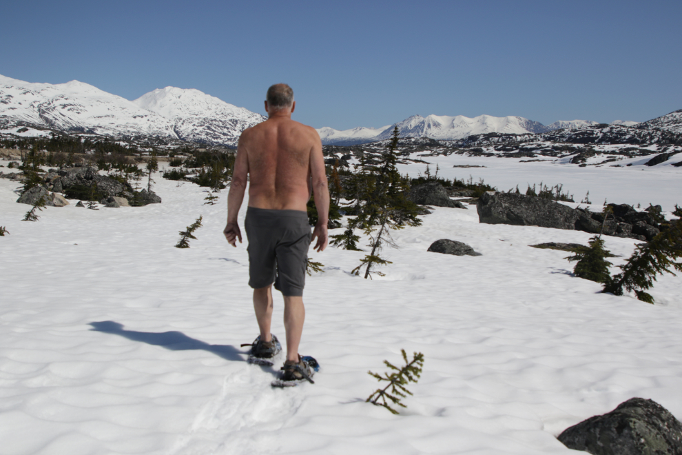 Snowshoeing at Summit Lake in the White Pass, wearing just shorts