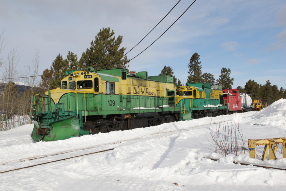 The work train at Carcross, powered by ALCO locomotives #109 and #104, is still snowed in.