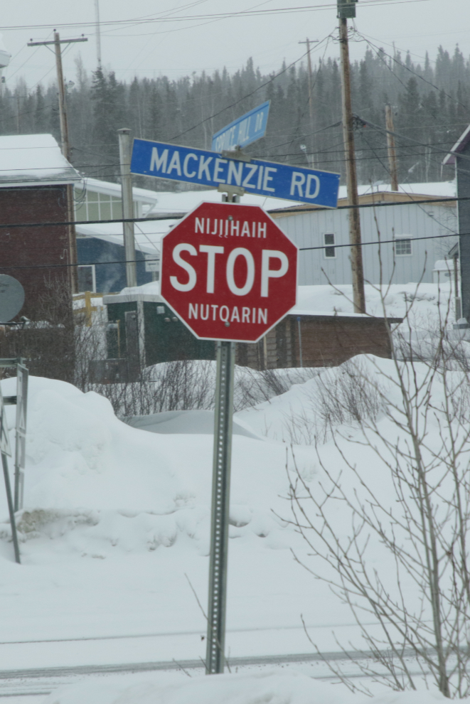 A multi-lingual stop sign in downtown Inuvik, NWT, in April.