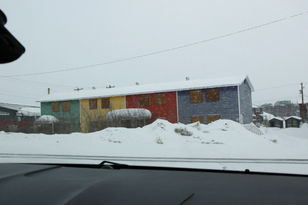 Colourful but abandoned homes in downtown Inuvik, NWT, in April.