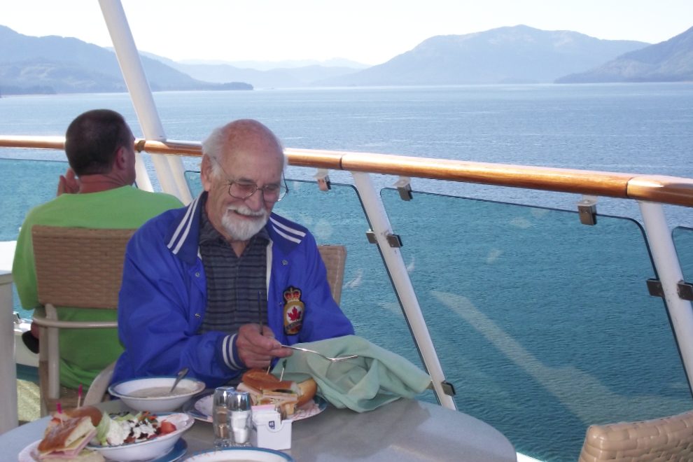 Robert Lundberg having lunch on an aft deck of the Radiance of the Seas while anchored at Icy Strait Point (Hoonah, Alaska)