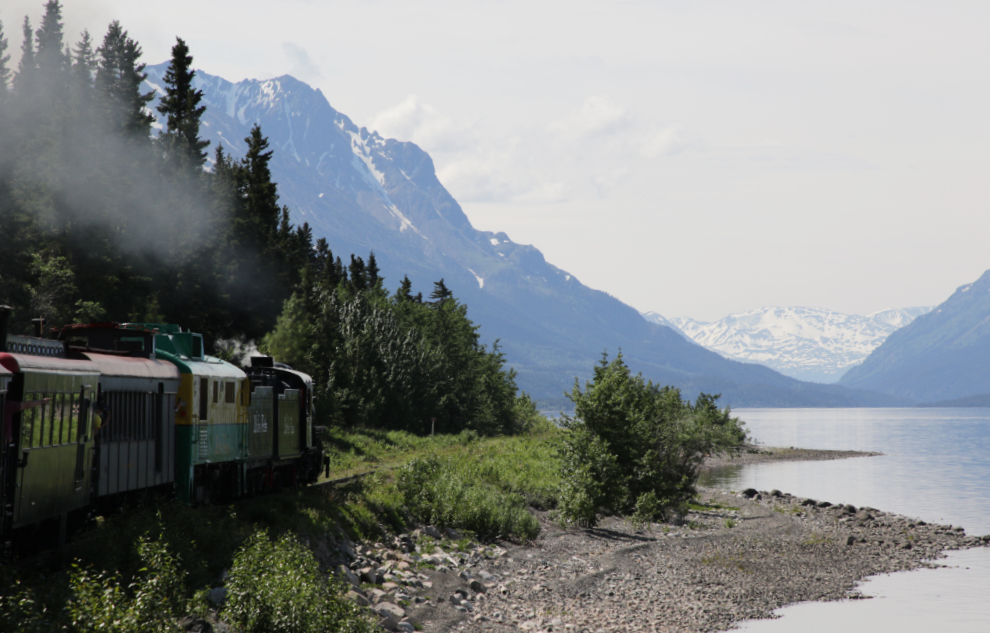 A WP&YR steam train excursion along Lake Bennett.