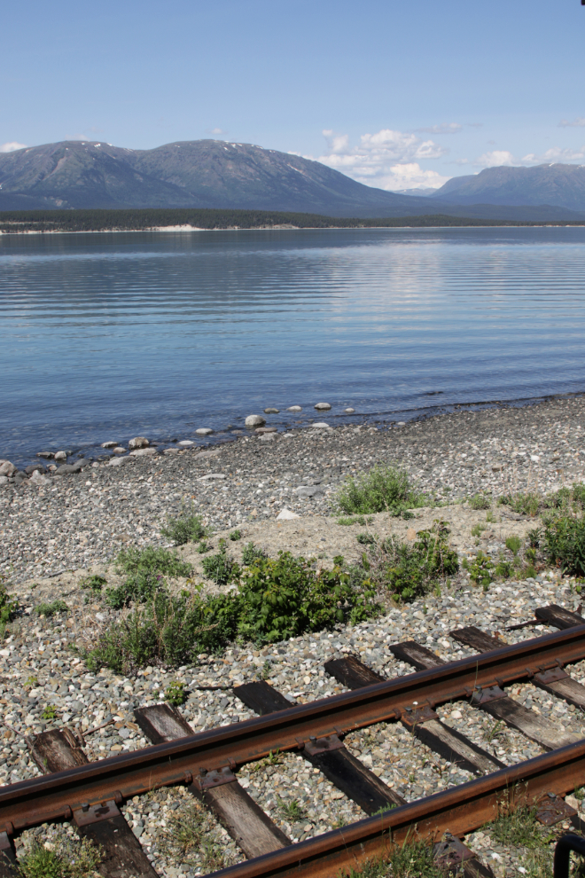 The White Pass rail line along Lake Bennett, Yukon.