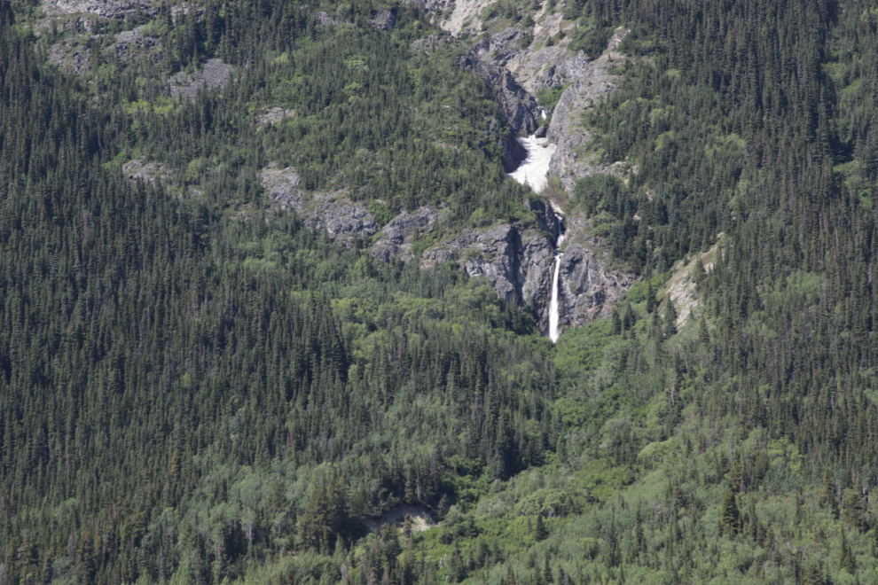 Large waterfall along Lake Bennett, BC.