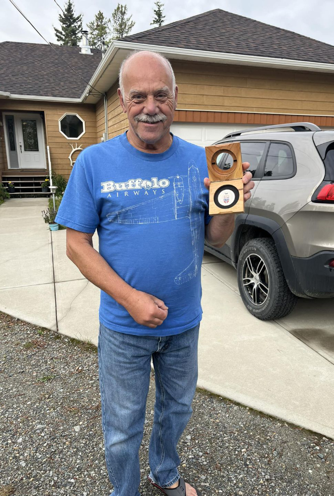 Murray Lundberg receiving a Yukon 125 commemorative medal