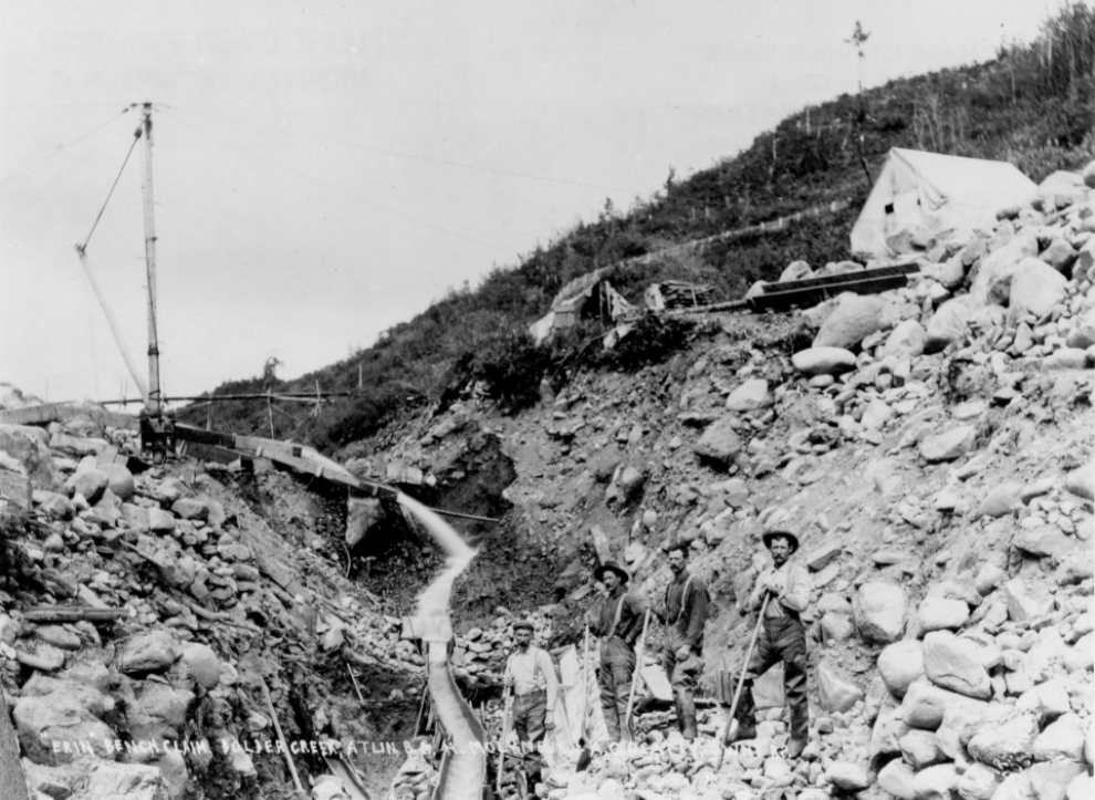 Placer gold mining on Boulder Creek at Atlin, BC, ca. 1899-1900.