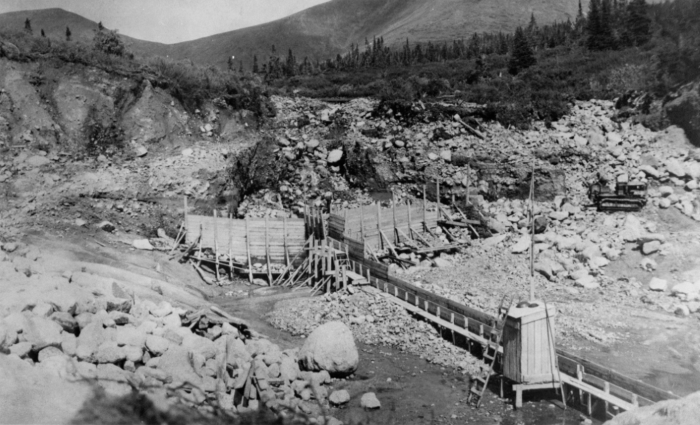 Building the wooden Boulder Creek dam at Atlin, BC, in 1921.