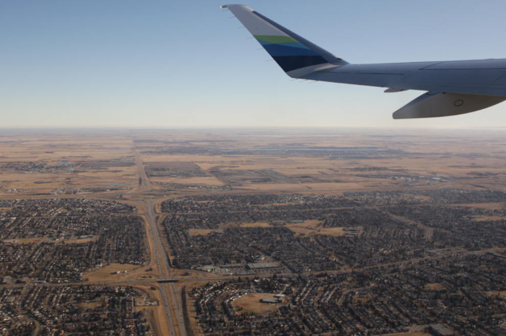 Departing from Calgary in Horizon Air's 2023 Embraer ERJ-175, N656QX.