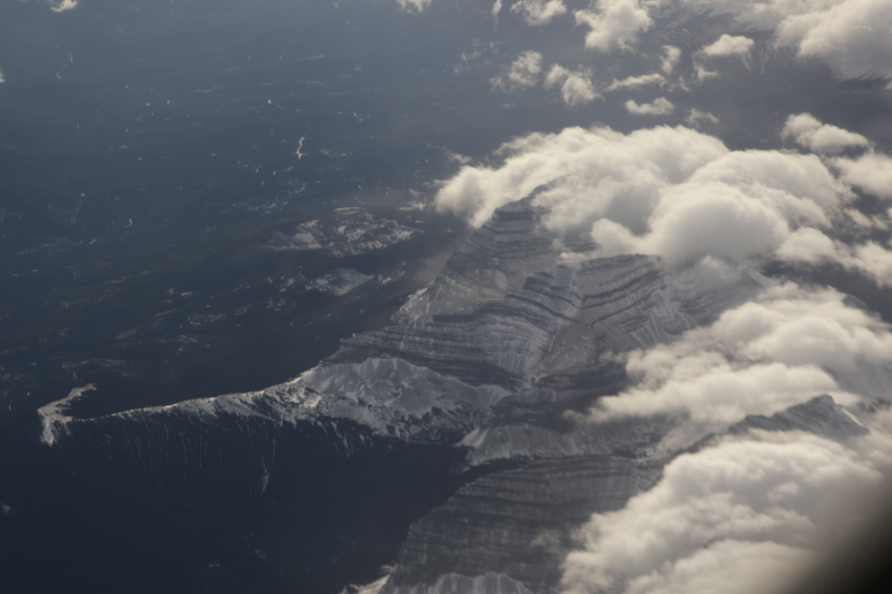 An aerial view of a bit of the Rockies, with cloud moving in.