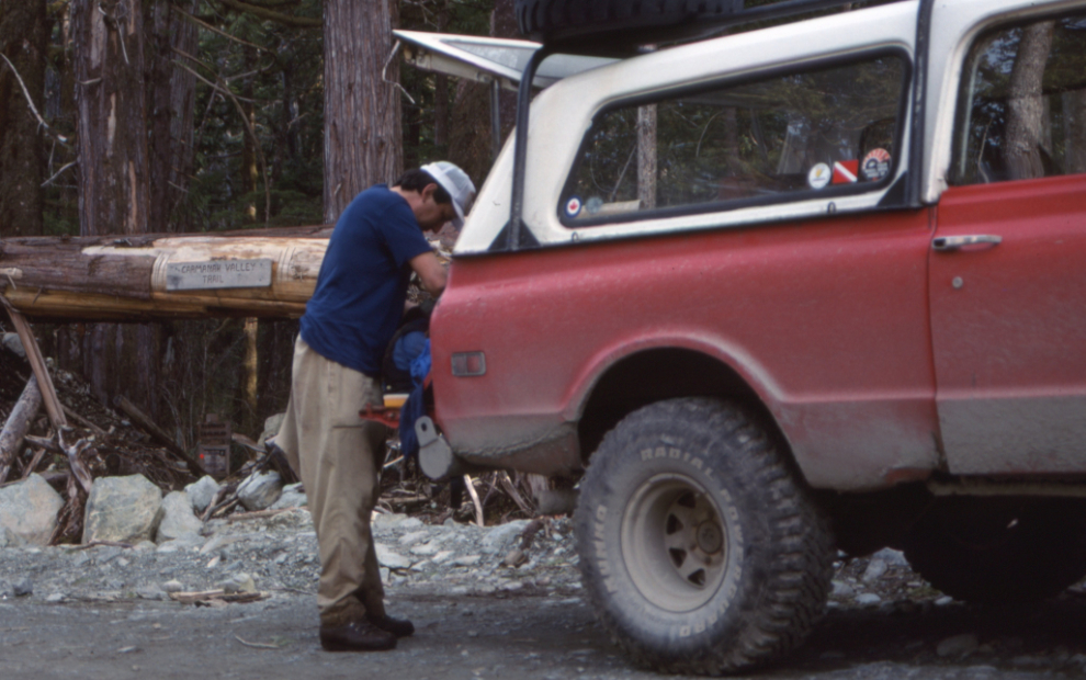 At the trailhead, probably mid-afternoon. The carved sign saus "Carmanah Valley Trail."