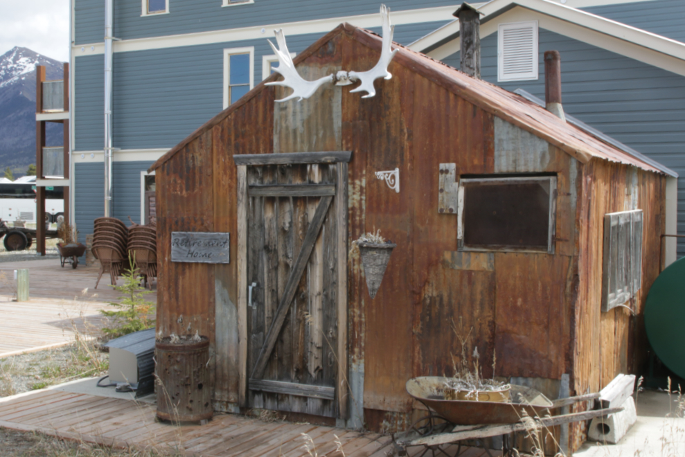 An old corrugated iron building behind the Caribou Hotel in Carcross, Yukon.